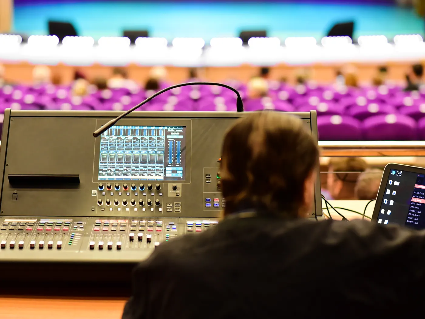 Sound engineer at a mixing console