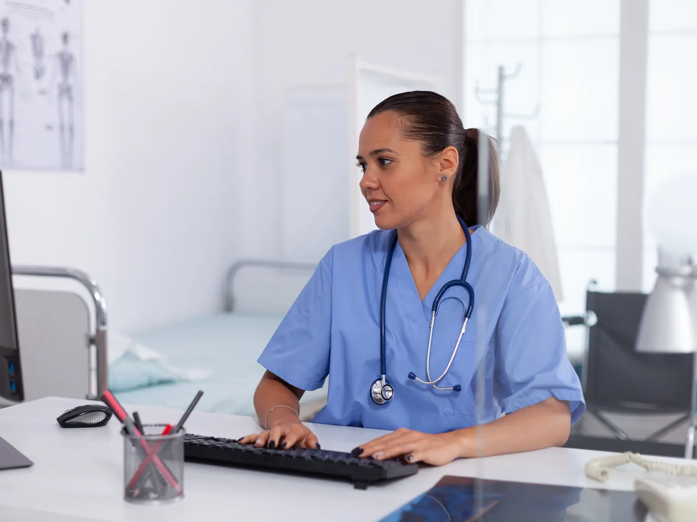 Doctor using a computer in a medical office